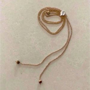 Lariat beaded champagne color necklace. NEW